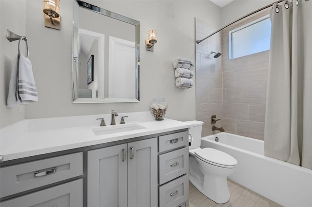 bathroom with vanity, toilet, and shower / bath combo