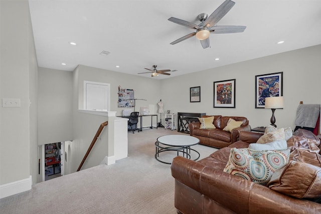 carpeted living room with visible vents, recessed lighting, and baseboards