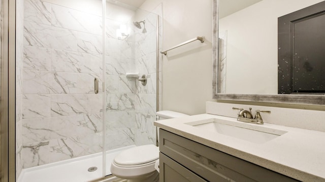 full bathroom featuring toilet, a shower stall, and vanity