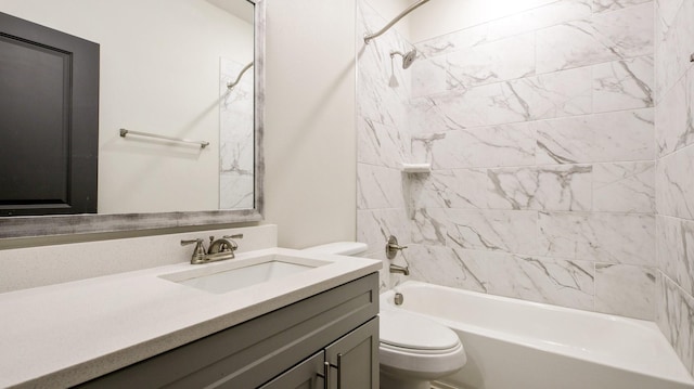 bathroom featuring toilet, shower / bath combination, and vanity