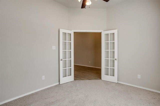 spare room featuring baseboards, a ceiling fan, carpet flooring, and french doors