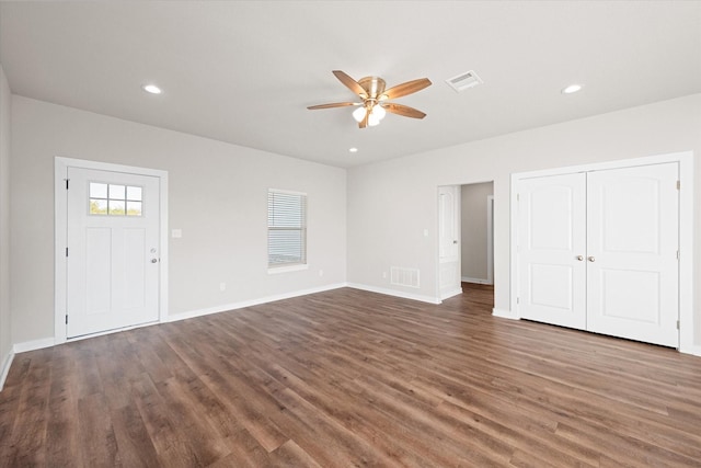 interior space featuring baseboards, visible vents, wood finished floors, and recessed lighting