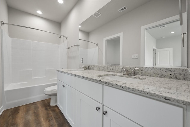 full bath with visible vents, a sink, and toilet