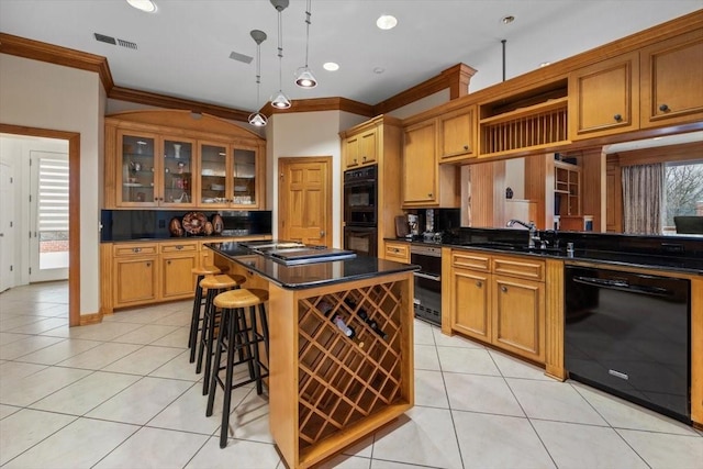 kitchen with light tile patterned floors, a sink, visible vents, black appliances, and dark countertops