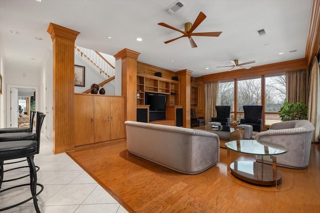 living room with recessed lighting, visible vents, decorative columns, and ceiling fan