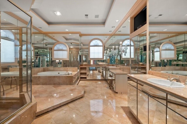 bathroom with vanity, a raised ceiling, a bath, and a shower stall