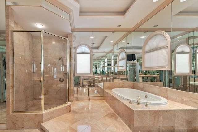 full bathroom featuring a tray ceiling, a stall shower, and a bath