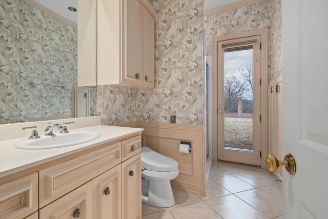 full bathroom featuring wallpapered walls, toilet, ornamental molding, tile patterned flooring, and vanity