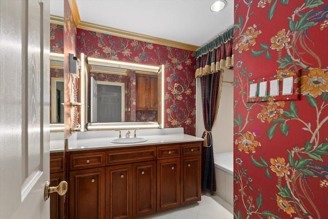 full bathroom featuring tile patterned flooring, crown molding, vanity, and wallpapered walls