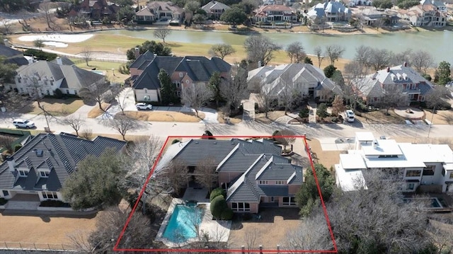 bird's eye view featuring a water view and a residential view