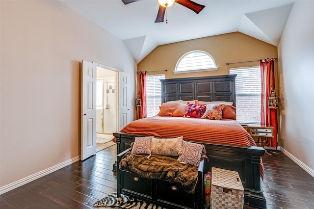bedroom featuring dark wood-style floors, baseboards, and lofted ceiling