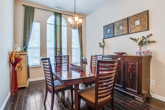 dining area with a wealth of natural light, baseboards, and dark wood finished floors