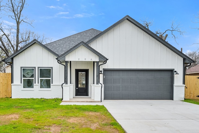 modern inspired farmhouse with concrete driveway, roof with shingles, an attached garage, fence, and board and batten siding