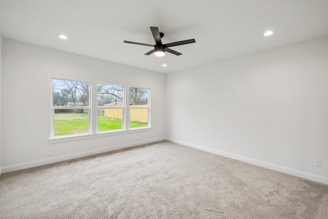 empty room with baseboards, carpet flooring, and recessed lighting