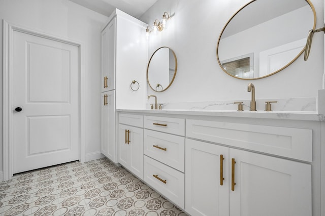 bathroom with double vanity and a sink