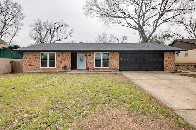 ranch-style house with an attached garage, brick siding, driveway, roof with shingles, and a front lawn