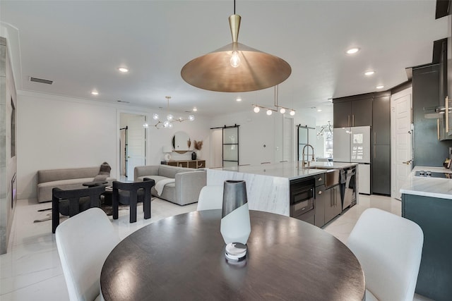 dining area featuring a barn door, visible vents, crown molding, and recessed lighting