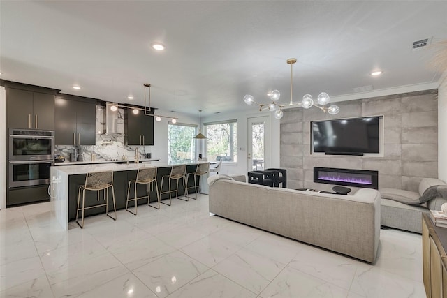 living room with recessed lighting, marble finish floor, visible vents, and a fireplace