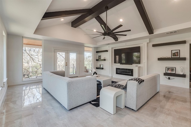 living room with french doors, a glass covered fireplace, visible vents, and a healthy amount of sunlight