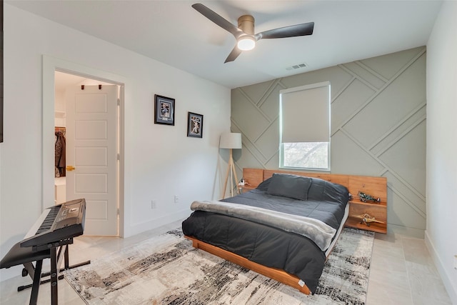 bedroom featuring baseboards, visible vents, and ceiling fan