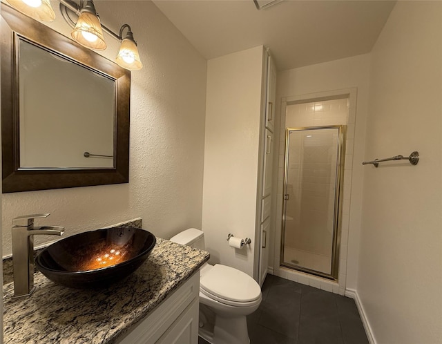 full bathroom with toilet, a stall shower, tile patterned flooring, and vanity