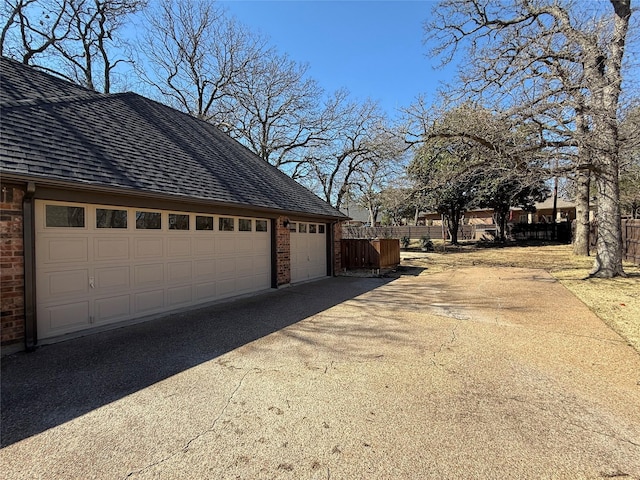 garage featuring fence