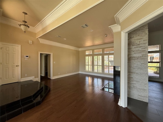 unfurnished room featuring dark wood-style floors, ornamental molding, visible vents, and baseboards