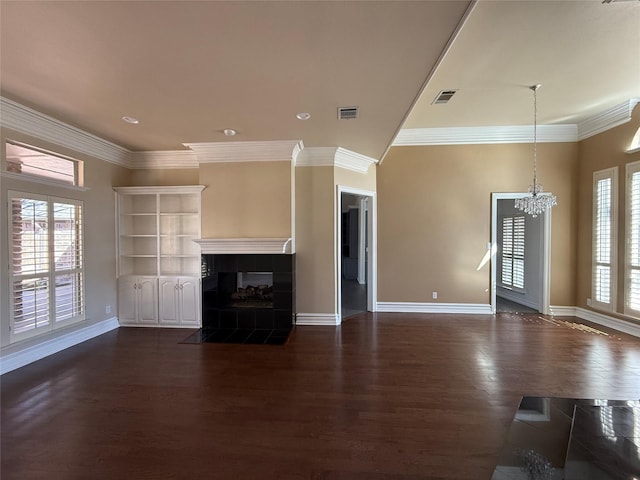 unfurnished living room with a tiled fireplace, dark wood finished floors, visible vents, and baseboards