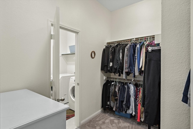 walk in closet with carpet flooring