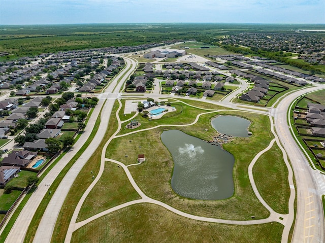 birds eye view of property featuring a water view and a residential view