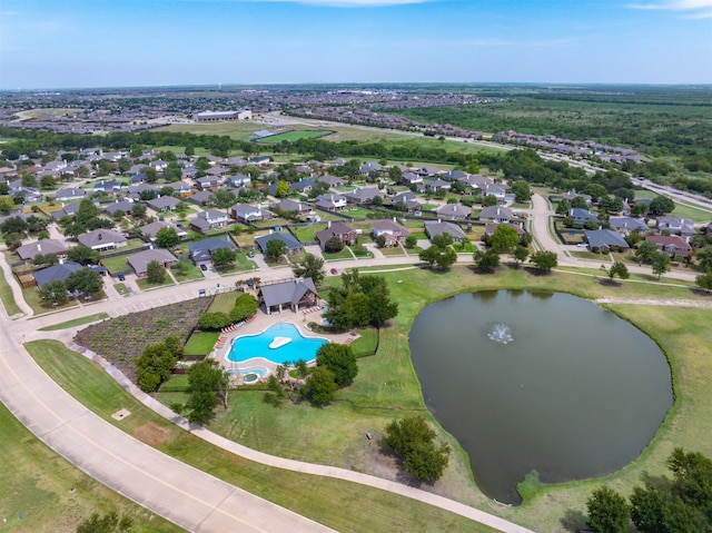 birds eye view of property with a residential view and a water view