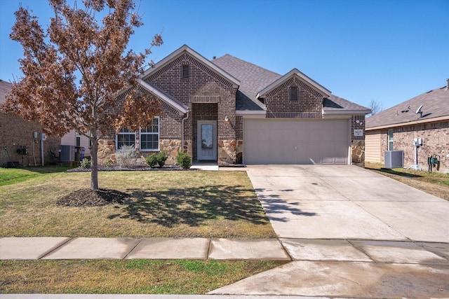 view of front of home with a garage, central AC, driveway, and a front lawn