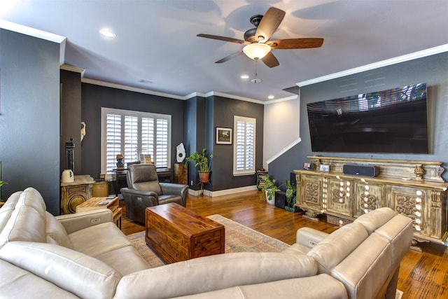 living room featuring ornamental molding, hardwood / wood-style floors, and a ceiling fan