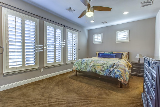 bedroom with carpet floors, baseboards, and visible vents