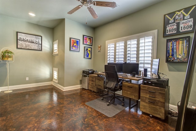 office space with finished concrete flooring, ceiling fan, recessed lighting, and baseboards