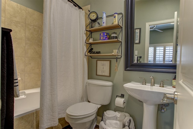 bathroom featuring toilet and shower / bath combo with shower curtain