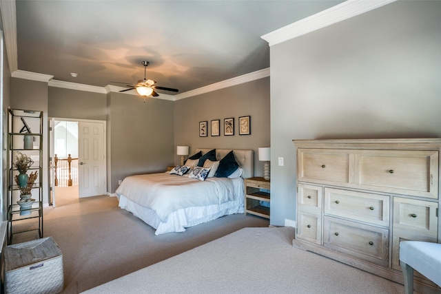 bedroom with ornamental molding, carpet, and a ceiling fan