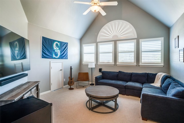 living room featuring lofted ceiling, baseboards, a ceiling fan, and light colored carpet