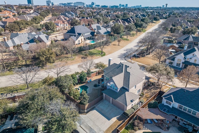 birds eye view of property with a residential view