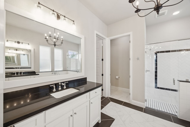 full bath with a stall shower, visible vents, a notable chandelier, and vanity