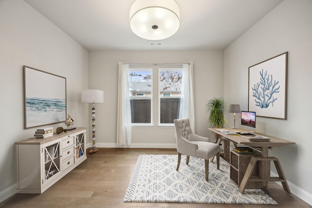 office featuring light wood finished floors and baseboards