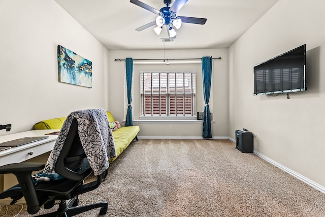 office featuring ceiling fan, carpet, visible vents, and baseboards