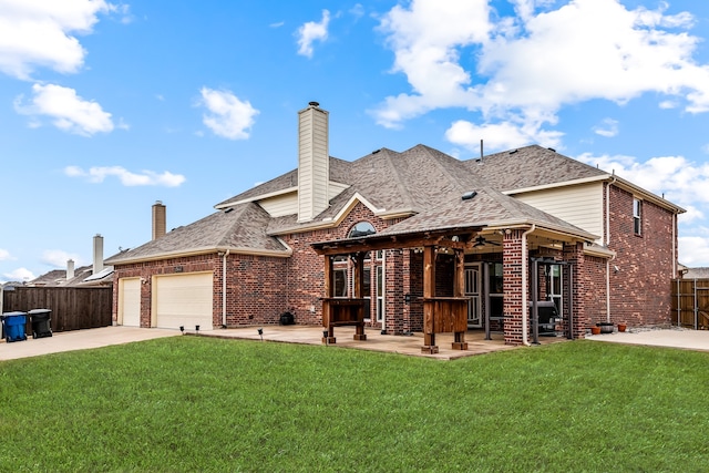 back of property featuring brick siding, a yard, a patio, and fence