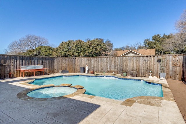 view of swimming pool with a patio area, a fenced backyard, and a pool with connected hot tub