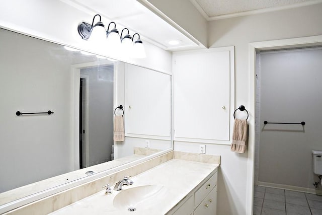 bathroom with baseboards, toilet, tile patterned flooring, a textured ceiling, and vanity