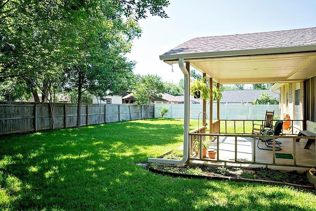 view of yard with a fenced backyard and a patio