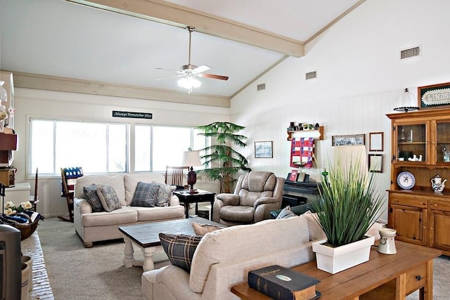 living room featuring light carpet, beam ceiling, and visible vents