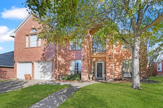 colonial house with a garage, driveway, brick siding, and a front yard