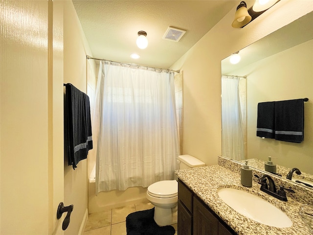 bathroom with tile patterned flooring, toilet, vanity, visible vents, and shower / bath combination with curtain