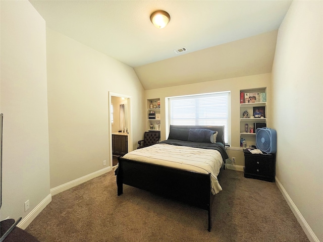 carpeted bedroom with baseboards, visible vents, vaulted ceiling, and ensuite bathroom